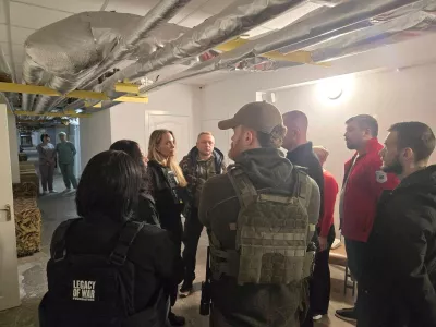 Angelina Jolie and others stand indoors with flak jackets on, in Kherson, Ukraine, in this handout image released on November 6, 2025. Legacy of War Foundation/Handout via REUTERS ATTENTION EDITORS - THIS IMAGE WAS PROVIDED BY A THIRD PARTY. MANDATORY CREDIT