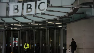A person walks outside the BBC Headquarters in London, Monday, Nov. 10, 2025. (AP Photo/Kin Cheung)