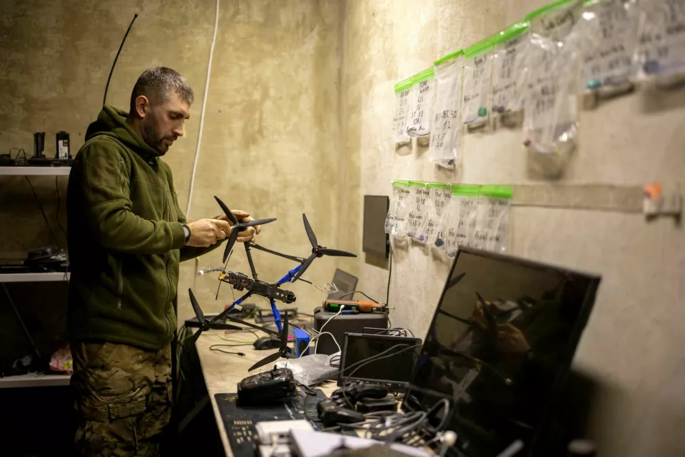 Senior sergeant of a drone unit of the 7th Rapid Response Corps with the callsign Filosof, works on a drone before his unit's deployment to Pokrovsk, amid Russia's attack on Ukraine, at an undisclosed location in eastern Ukraine, November 4, 2025. REUTERS/Thomas Peter
