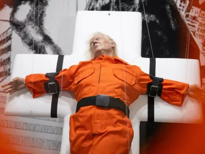 This photograph shows the art piece by British artist Mason Storm called "Saint or Sinner", depicting US President Donald Trump dressed in an orange prison jumpsuit on a cross, displayed at an exhibition space in Basel on November 3, 2025.,Image: 1050059853, License: Rights-managed, Restrictions: RESTRICTED TO EDITORIAL USE - MANDATORY MENTION OF THE ARTIST UPON PUBLICATION - TO ILLUSTRATE THE EVENT AS SPECIFIED IN THE CAPTION, Model Release: no