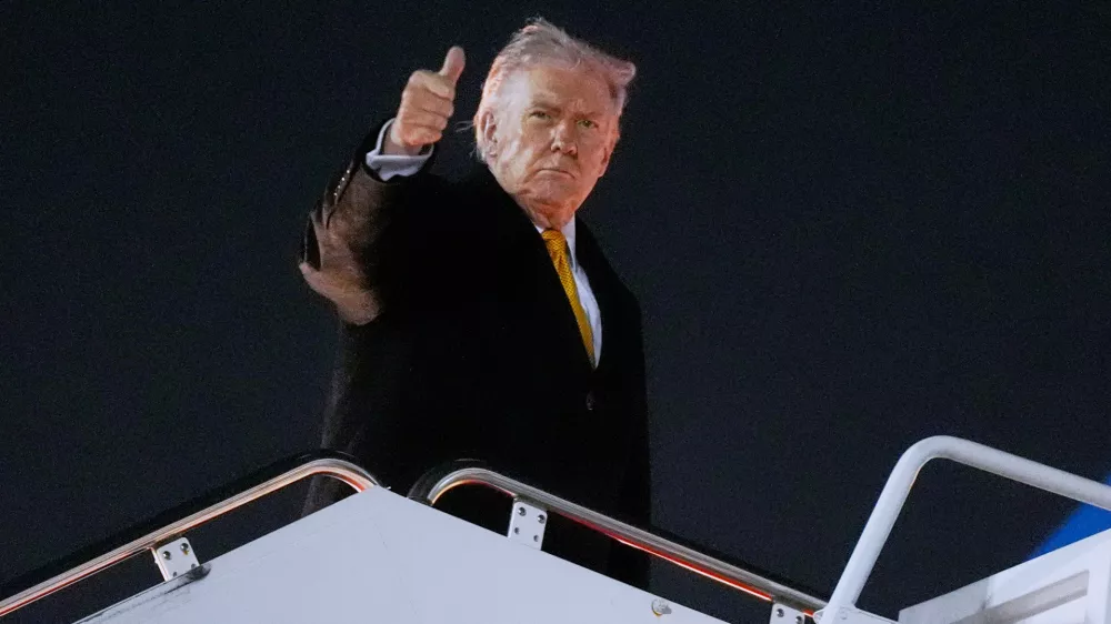 President Donald Trump boards Air Force One on his way to his Mar-a-Lago estate in Palm Beach, Fla., from Joint Base Andrews, Md., Friday, Nov. 7, 2025. (AP Photo/Manuel Balce Ceneta)