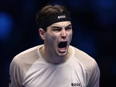 Tennis - ATP Finals - Turin - Palasport Olimpico, Turin, Italy - November 10, 2025 Taylor Fritz of the U.S. celebrates after winning his round robin match against Italy's Lorenzo Musetti REUTERS/Guglielmo Mangiapane