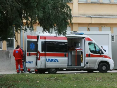BELGRADE, SERBIA - DECEMBER 24: Health care workers are seen near an ambulance in Belgrade, Serbia on December 24, 2020. Serbia launched a free coronavirus vaccination campaign starting from nursing homes and also a representative of the government to set an example showing that the vaccine is valid. The first batch of the BioNTech/Pfizer vaccine, comprising 4,800 doses. Milos Miskov / Anadolu Agency,Image: 578446255, License: Rights-managed, Restrictions:, Model Release: no