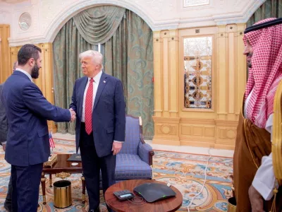 FILE PHOTO: U.S. President Donald Trump meets Syrian President Ahmed al-Sharaa in Riyadh, Saudi Arabia, in this handout released on May 14, 2025. Saudi Press Agency/Handout via REUTERS THIS IMAGE HAS BEEN SUPPLIED BY A THIRD PARTY/File Photo