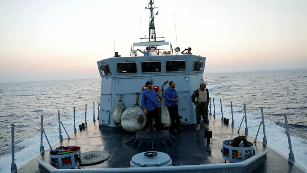 Members of the Libyan Coast Guard search for migrants off the coast of Tripoli, Libya, August 9, 2017. REUTERS/Hani Amara