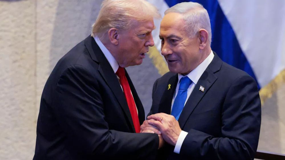 FILE - President Donald Trump talks with Israel's Prime Minister Benjamin Netanyahu at the Knesset, Israel's parliament, Monday, Oct. 13, 2025, in Jerusalem. (Chip Somodevilla/Pool via AP, file)