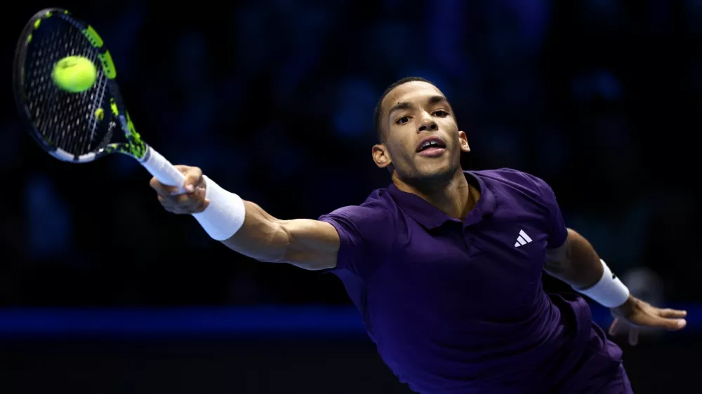 Tennis - ATP Finals - Turin - Palasport Olimpico, Turin, Italy - November 12, 2025 Canada's Felix Auger Aliassime in action during his group stage match against Ben Shelton of the U.S. REUTERS/Guglielmo Mangiapane