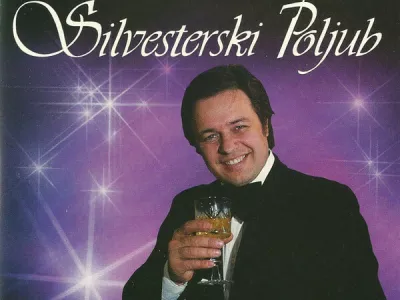 Silvestrski poljub Alfi Nipič / Foto: Ovitek Plo&scaron;če