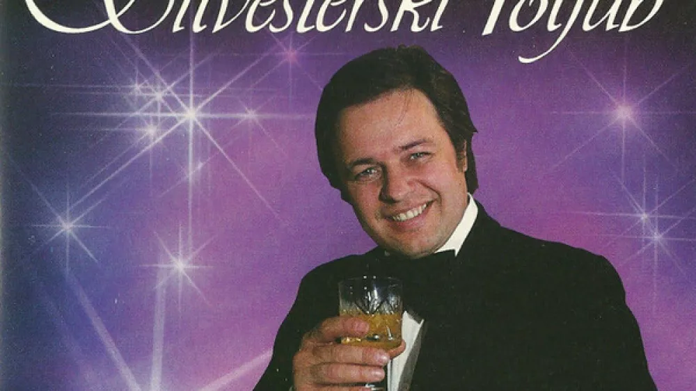 Silvestrski poljub Alfi Nipič / Foto: Ovitek Plo&scaron;če