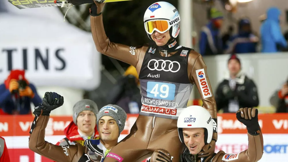 Ski Jumping - 65th four-hills ski jumping tournament final round - Bischofshofen, Austria - 06/01/2017 - Poland's Kamil Stoch celebrates among his compatriots after winning the 65th four-hills tournament.  REUTERS/Dominic Ebenbichler