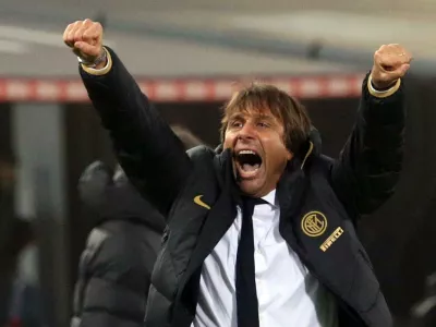 Inter coach Antonio Conte celebrates his team's victory at the end of the Italian Serie A soccer match between Bologna and Inter Milan at the Renato Dall'Ara stadium in Bologna, Italy, Saturday, Nov. 2, 2019. (Giorgio Benvenuti/ANSA via AP)