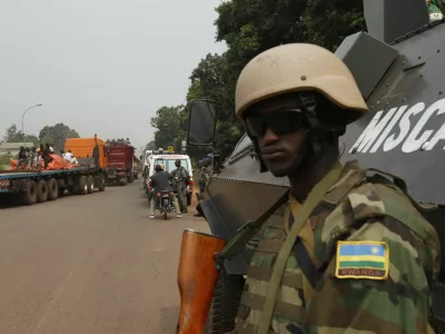 African peace keeping soldiers escort a humanitarian convoy in Bangui, February 15, 2014. France said on Friday it plans to send another 400 troops to help combat a crisis in the Central African Republic as U.N. chief Ban Ki-moon pleaded for more swift, robust international help to stop sectarian violence that could turn into a genocide. REUTERS/Luc Gnago (CENTRAL AFRICAN REPUBLIC - Tags: POLITICS CIVIL UNREST MILITARY) - RTX18VGQ