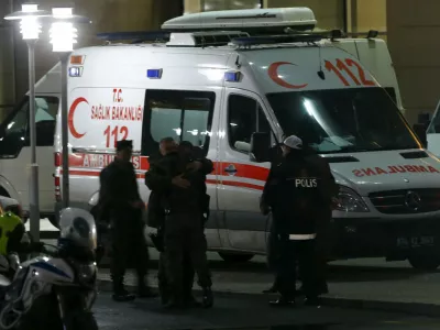 Members of Turkish police special forces unit hug each other at the end of the hostage situation at the Justice Palace in Istanbul March 31, 2015. A website with links to a Turkish far-left group which has been holding a prosecutor captive in Istanbul said on its Twitter feed late on Tuesday that the hostage had been shot and injured, whilst his three captors had been killed. "Our three friends have been shot to death," one tweet read. It was not possible to independently verify the information. The tweets were posted shortly after gunfire was heard at the building and two ambulances were seen racing away from the scene, according to a Reuters witness. REUTERS/Osman Orsal