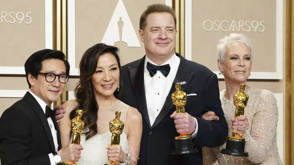 Ke Huy Quan, from left, Michelle Yeoh, Brendan Fraser and Jamie Lee Curtis pose with their awards in the press room at the Oscars on Sunday, March 12, 2023, at the Dolby Theatre in Los Angeles. Brendan Fraser, third from left, won best performance by an actor in a leading role for "The Whale." Ke Huy Quan, from left, Michelle Yeoh and Jamie Lee Curtis all won for their leading and supporting roles in "Everything Everywhere All at Once." (Photo by Jordan Strauss/Invision/AP)