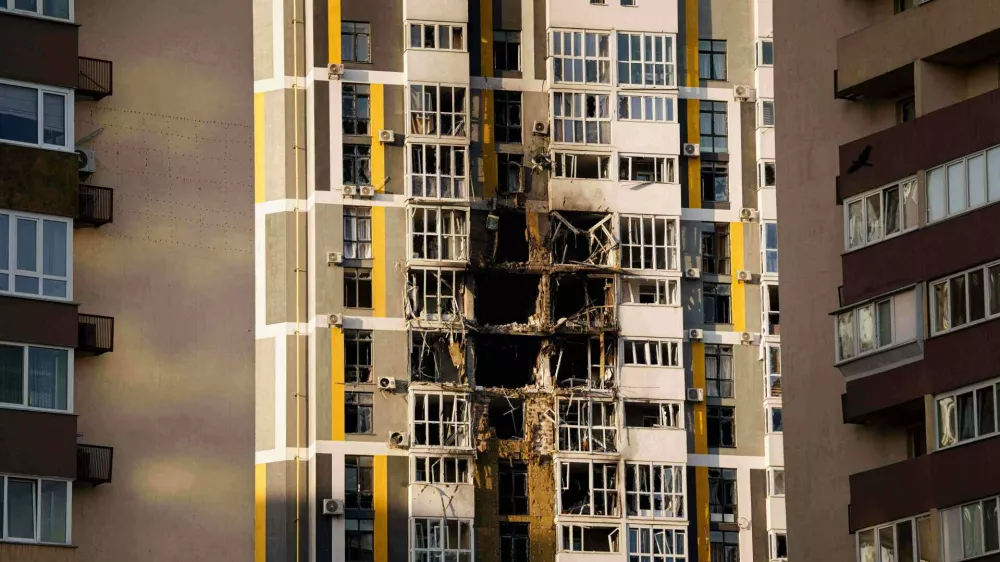 A residential building shows damage after a Russian attack on Kyiv, Ukraine, Friday, Nov. 14, 2025. (AP Photo/Evgeniy Maloletka)