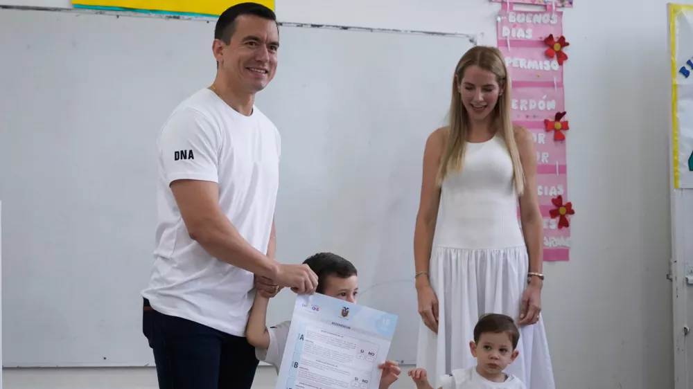 Ecuadorian President Daniel Noboa, accompanied by his family, votes in a referendum on whether to allow foreign military bases in the country and rewrite the constitution through a constituent assembly, in Olon, Ecuador, Sunday, Nov. 16, 2025. (AP Photo/Cesar Munoz)
