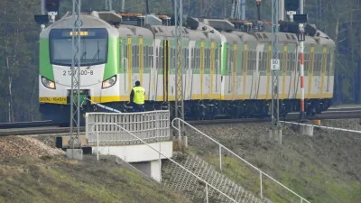 A policeman stands near the train at the site of the blast on railways on the Warsaw-Lublin line in Mika, Poland, November 16, 2025. Dariusz Borowicz/Agencja Wyborcza.pl via REUTERS ATTENTION EDITORS - THIS IMAGE WAS PROVIDED BY A THIRD PARTY. POLAND OUT. NO COMMERCIAL OR EDITORIAL SALES IN POLAND.