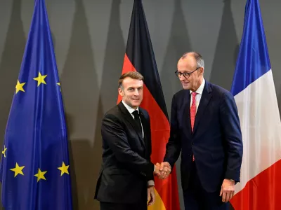 France's President Emmanuel Macron and Germany's Chancellor Friedrich Merz shake hands ahead of a bilateral meeting at the sidelines of a summit on Europe's technological sovereignty, in the EUREF Campus in Berlin, Germany, November 18, 2025.   JOHN MACDOUGALL/Pool via REUTERS