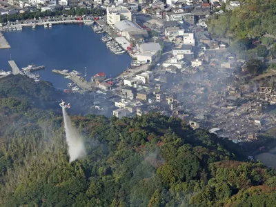 Smoke rises from the site where a massive fire blazed through more than 170 buildings, as seen from a helicopter, in Oita, Oita Prefecture, southwestern Japan, November 19, 2025, in this photo taken by Kyodo. Mandatory credit Kyodo/via REUTERS ATTENTION EDITORS - THIS IMAGE HAS BEEN SUPPLIED BY A THIRD PARTY. MANDATORY CREDIT. JAPAN OUT. NO COMMERCIAL OR EDITORIAL SALES IN JAPAN.   TPX IMAGES OF THE DAY