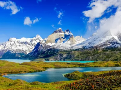 Beautiful Patagonia landscape of Andes mountain range, winding road and lake at Torres del Paine National Park, Chile.