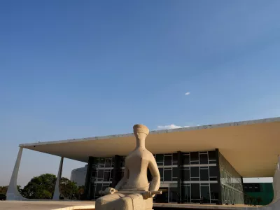 FILE - The Statue of Justice stands in front of the Supreme Court during the verdict and sentencing phase of a trial for those charged in an alleged coup plot to keep Brazil's former President Jair Bolsonaro in office after his 2022 election defeat, in Brasilia, Brazil, Sept. 11, 2025. (AP Photo/Eraldo Peres, File)