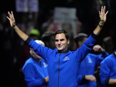 An emotional Roger Federer of Team Europe acknowledges the crowd after playing with Rafael Nadal in a Laver Cup doubles match against Team World's Jack Sock and Frances Tiafoe at the O2 arena in London, Friday, Sept. 23, 2022. Federer's losing doubles match with Nadal marked the end of an illustrious career that included 20 Grand Slam titles and a role as a statesman for tennis. (AP Photo/Kin Cheung)