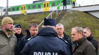 Prime Minister Donald Tusk, second right, visits site of the rail line Mika, that was damaged by sabotage, near Deblin, Poland, Monday, Nov. 17, 2025. (AP Photo/KPRM)