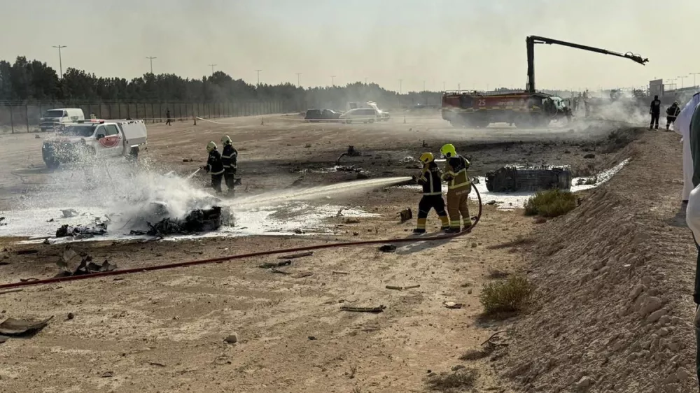 Firefighters work at the site of a crash involving an Indian-made HAL Tejas fighter jet at the Dubai Air Show, United Arab Emirates, November 21, 2025, in this handout picture obtained from social media. Government of Dubai Media Office/Handout via REUTERS THIS IMAGE HAS BEEN SUPPLIED BY A THIRD PARTY. MANDATORY CREDIT.