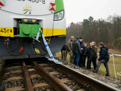 FILE PHOTO: Koleje Mazowieckie train sits on the track with police tape as Polish Prime Minister Donald Tusk visits the site of a blast on railway of the Warsaw-Lublin line in Mika, Poland, November 17, 2025. KPRM/Handout via REUTERS ATTENTION EDITORS - THIS IMAGE HAS BEEN SUPPLIED BY A THIRD PARTY. NO RESALES. NO ARCHIVES/File Photo
