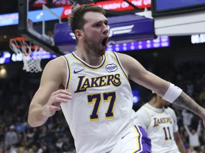 Nov 23, 2025; Salt Lake City, Utah, USA; Los Angeles Lakers guard Luka Doncic (77) reacts to a play against the Utah Jazz during the second quarter at Delta Center. Mandatory Credit: Rob Gray-Imagn Images