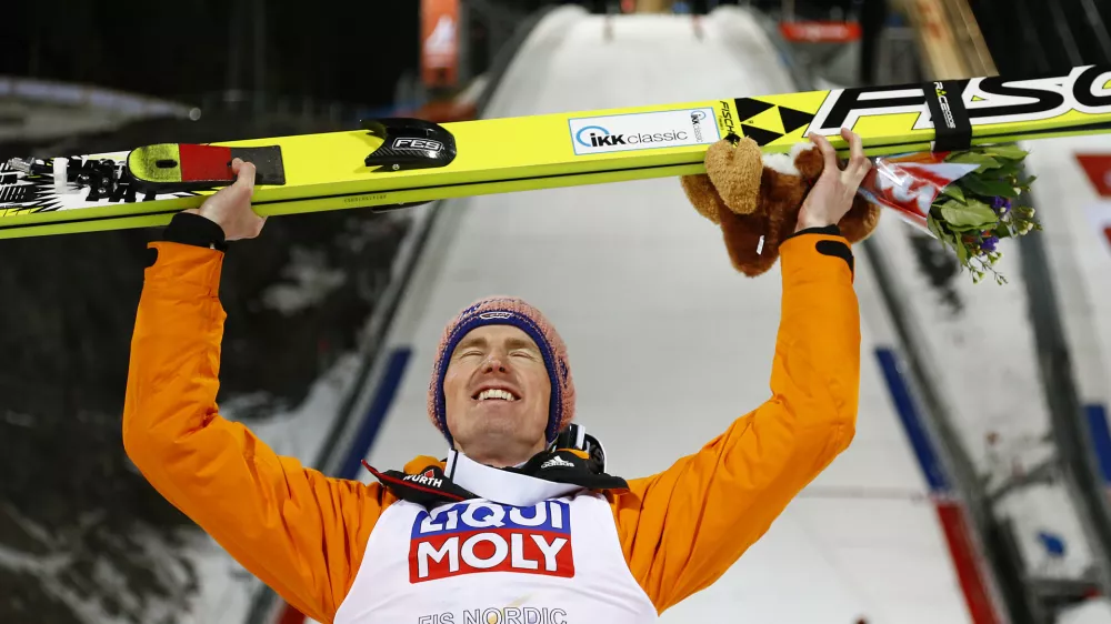 Germany's Severin Freund poses after winning the mens' Large Hill Individual competition at the Nordic Skiing World Championships in Falun, Sweden, Thursday, Feb. 26, 2015. (AP Photo/Matthias Schrader)