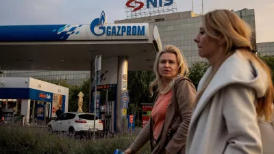 FILE PHOTO: People walk past a petrol station of the Russian oil producer Gazprom Neft, which is the major stakeholder in Serbian oil company NIS, in Belgrade, Serbia, October 8, 2025. REUTERS/Marko Djurica/File Photo