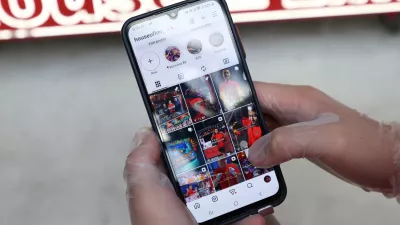 Dimi Heryxlim, 15, a social media content creator, poses while displaying his 'House of Lim' Instagram page at Burwood Chinatown in Sydney, Australia, November 14, 2025. REUTERS/Hollie Adams