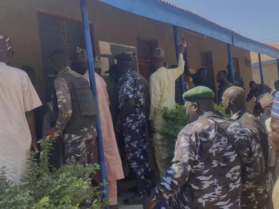 Police and government officials gather at St. Mary's Catholic Primary and Secondary School where gunmen on Friday abducted children and staff in Papiri community, Nigeria, Tuesday, Nov.25, 2025. (AP Photo/Yunusa Umar)