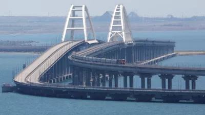 A train moves along the Crimean Bridge, a section of which was damaged by an alleged overnight attack, as seen from the city of Kerch, Crimea, July 17, 2023. REUTERS/Alexey Pavlishak