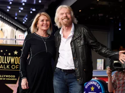 FILE - British business magnate Richard Branson, right, appears with his wife Joan Templeman Branson during a ceremony honoring him with a star on the Hollywood Walk of Fame, in Los Angeles, Oct. 16, 2018. (Photo by Chris Pizzello/Invision/AP, File)