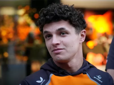 McLaren driver Lando Norris of Britain talks to the media at the Lusail International Circuit ahead of the Qatar Formula One Grand Prix, in Lusail, Qatar, Thursday, Nov. 27, 2025. (AP Photo/Darko Bandic)