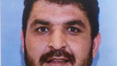 A picture of Rahmanullah Lakanwal, an Afghan national who is the suspect in the shooting of two National Guard members, is displayed at a press conference with FBI Director Kash Patel, attorney Jeanine Pirro and other authorities, in Washington, D.C., U.S., November 27, 2025. REUTERS/Nathan Howard