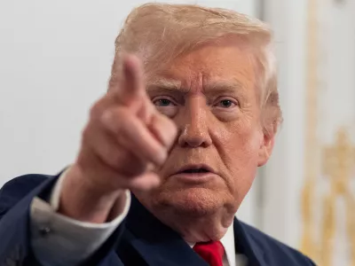 President Donald Trump speaks to reporters after speaking to troops via video from his Mar-a-Lago estate on Thanksgiving, Thursday, Nov. 27, 2025, in Palm Beach, Fla. (AP Photo/Alex Brandon)