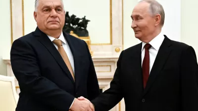 Russian President Vladimir Putin, right, and Hungarian Prime Minister Viktor Orban shake hands during their meeting at the Senate Palace of the Kremlin in Moscow, Russia, Friday, Nov. 28, 2025. (Alexander Nemenov/Pool Photo via AP)