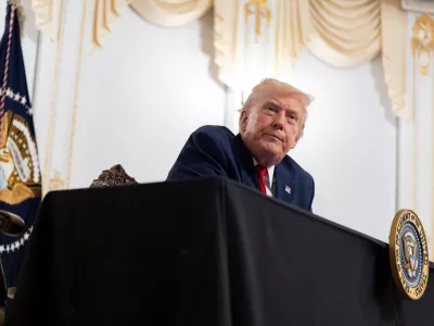 President Donald Trump speaks to reporters after speaking to troops via video from his Mar-a-Lago estate on Thanksgiving, Thursday, Nov. 27, 2025, in Palm Beach, Fla. (AP Photo/Alex Brandon)
