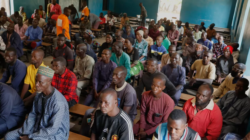 Parents of abducted School Children gather at the St. Mary's Catholic Primary and Secondary School in Papiri community, Nigeria, Friday, Nov. 28, 2025. (AP Photo)
