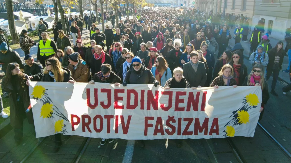 People carry a banner reading: "United against fascism" during a protest against what they say is the rising use of far-right symbols and rhetoric, in Zagreb, Croatia, November 30, 2025. REUTERS/Antonio Bronic