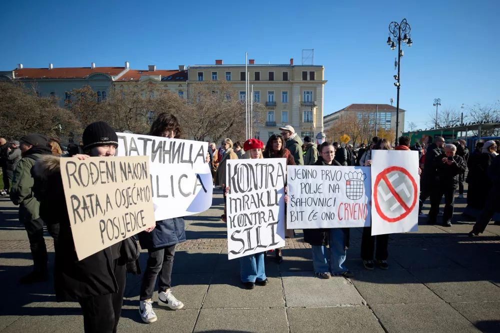 Protesters hold placards during a protest march against the surging far right following a spate of incidents targeting ethnic minorities and liberals, in Zagreb, Croatia, Sunday, Nov. 30, 2025. (AP Photo)