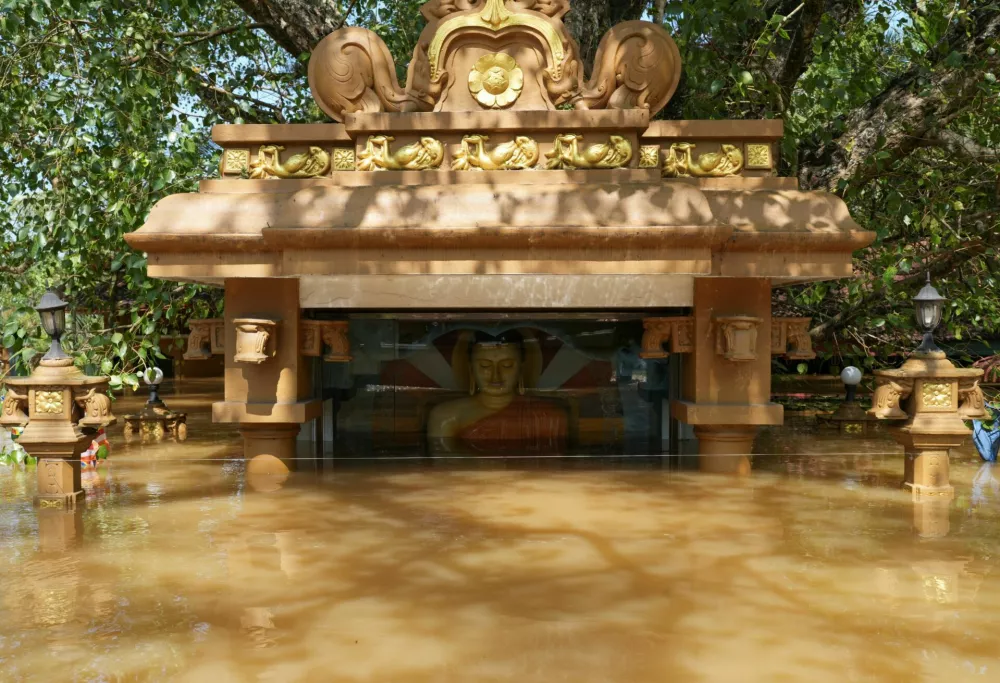 A partially submerged statue of Buddha in a flooded area, following Cyclone Ditwah in Kelaniya, Sri Lanka, November 30, 2025. REUTERS/Thilina Kaluthotage