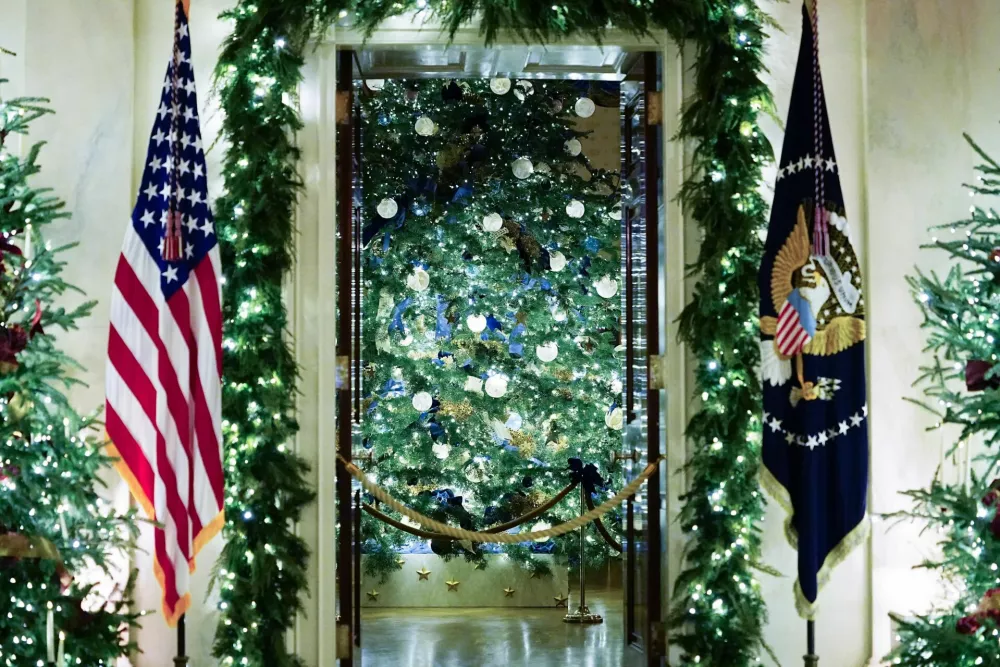Christmas trees in the Grand Foyer of the White House during a media preview of the 2025 holiday decorations at the White House in Washington, U.S., December 1, 2025. REUTERS/Aaron Schwartz