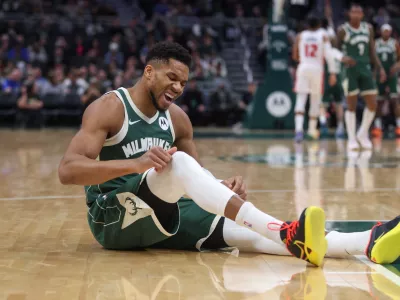 Milwaukee Bucks' Giannis Antetokounmpo reacts after suffering an injury during the first half an NBA basketball game against the Detroit Pistons, Wednesday, Dec. 3, 2025, in Milwaukee. (AP Photo/Kylie Bridenhagen)