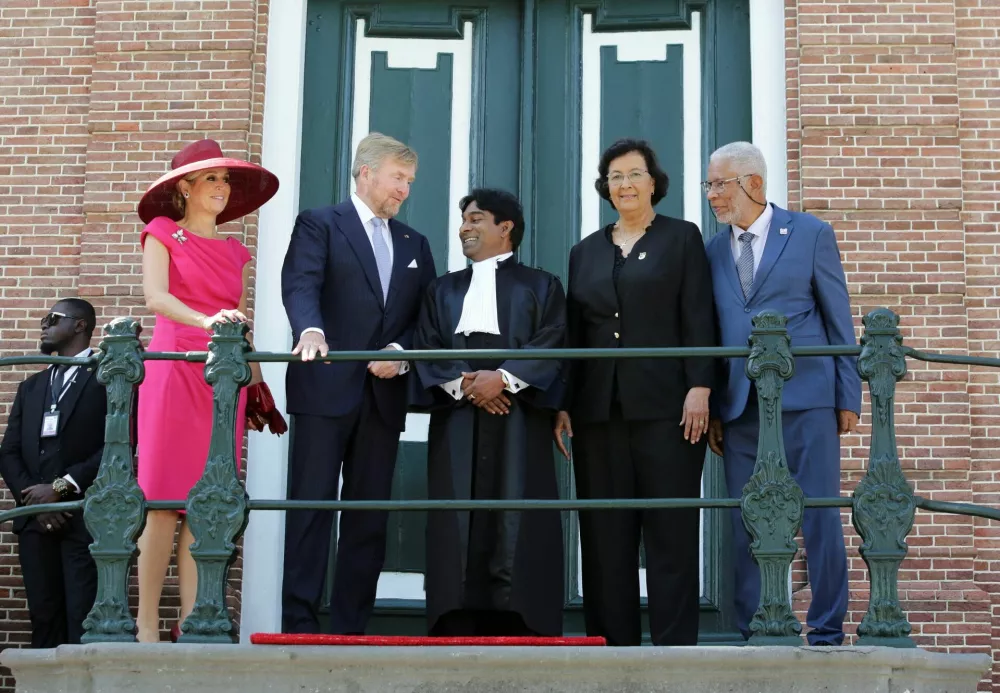 Dutch Queen Maxima, her husband King Willem-Alexander, President of Suriname's Court of Justice Iwan Rasoelbaks, Suriname's President Jennifer Geerlings-Simons and her husband Glenn Geerlings pose for a photograph, during an official visit of the Dutch royal couple, in Paramaribo, Suriname, December 1, 2025. REUTERS/Ranu Abhelakh