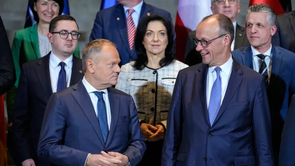 German Chancellor Friedrich Merz, front right, and Poland's Prime Minister Donald Tusk, front left, stand with Ministers of the German and Polish governments for a group photo after the German-Polish government consultations at the Chancellery in Berlin, Germany, Monday, Dec. 1, 2025. (AP Photo/Ebrahim Noroozi)