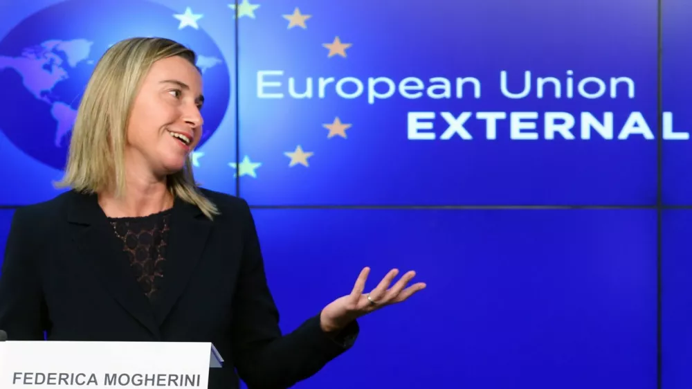 European Union foreign policy chief Federica Mogherini addresses a news conference after meeting NATO Secretary General Jens Stoltenberg (unseen) at the European External Action Service (EEAS) building in Brussels November 4, 2014.  REUTERS/Francois Lenoir (BELGIUM - Tags: POLITICS)